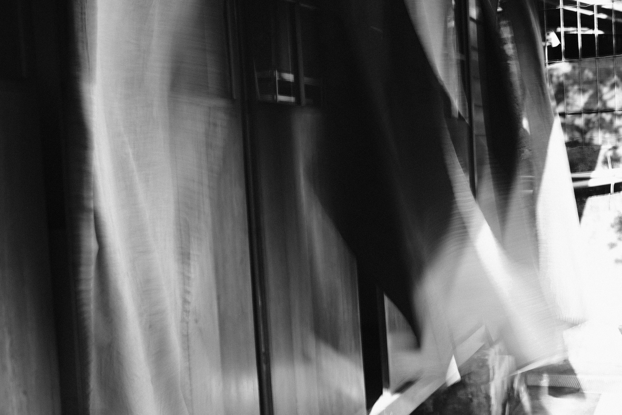 Ethereal motion blur effect on street pedestrians in an abstract city environment