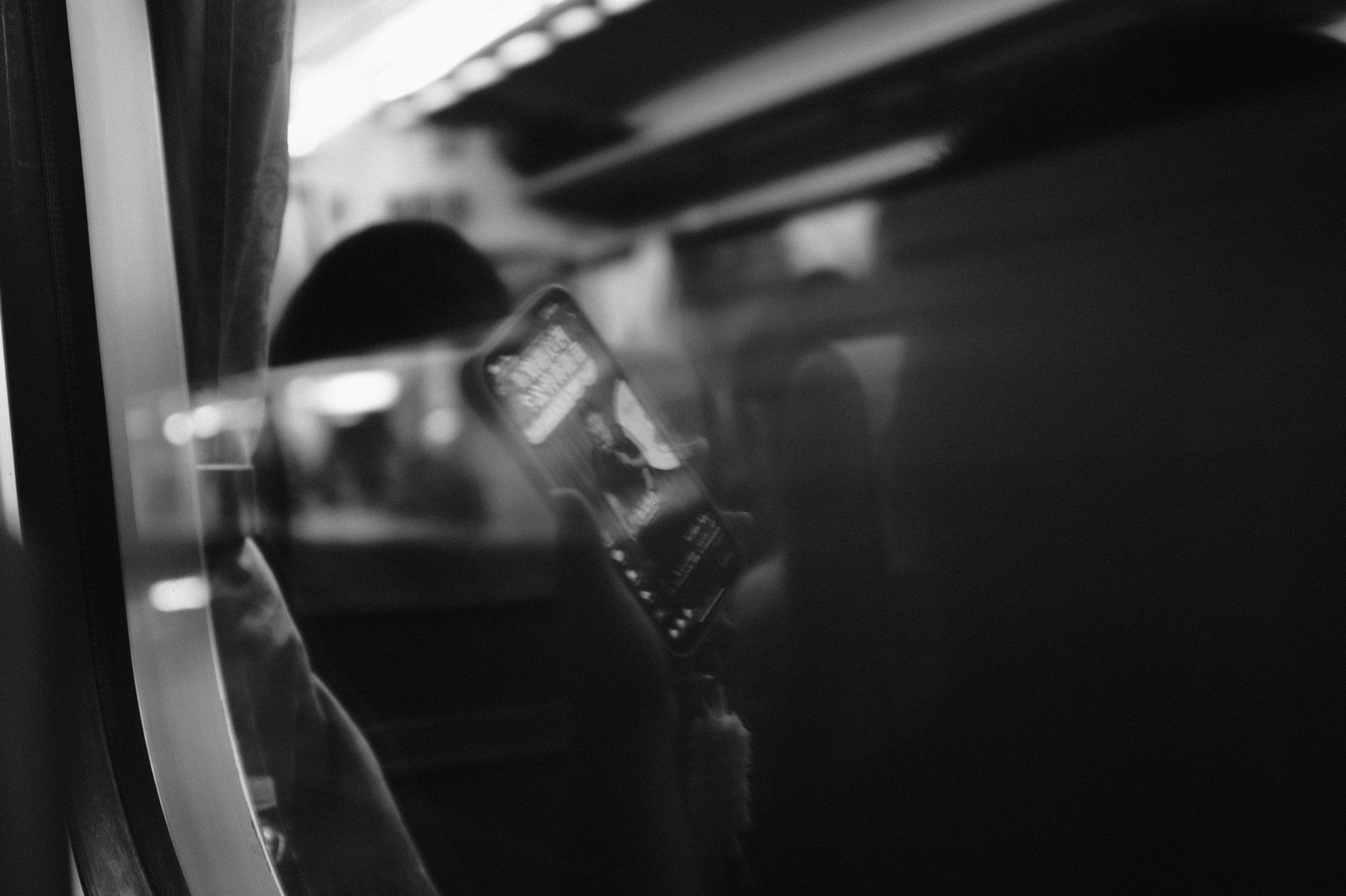 Ghostly blurred figures walking through a brightly lit urban Taiwan landscape