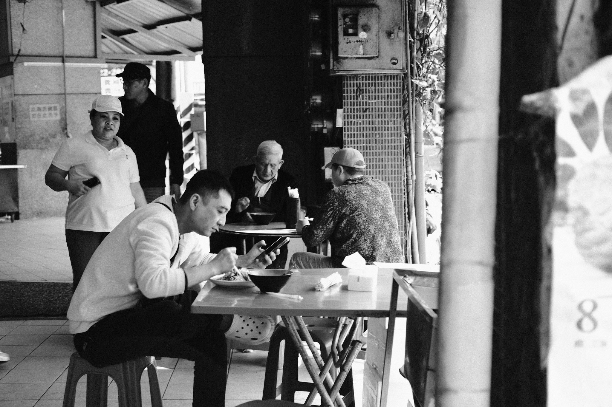 Candid moment at a local Keelung night market stall - street life
