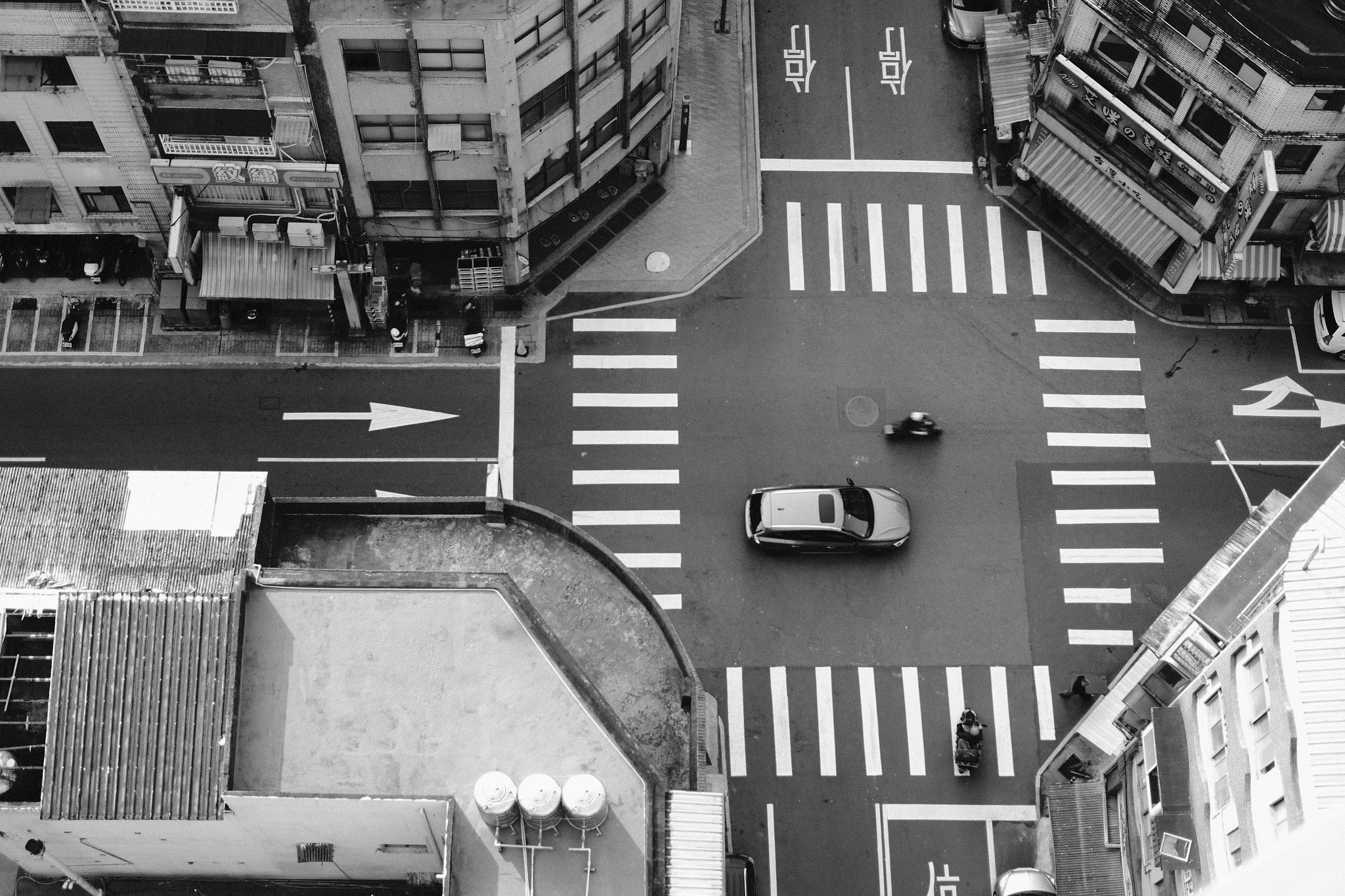 Reflections of neon lights on the wet streets of Keelung at night