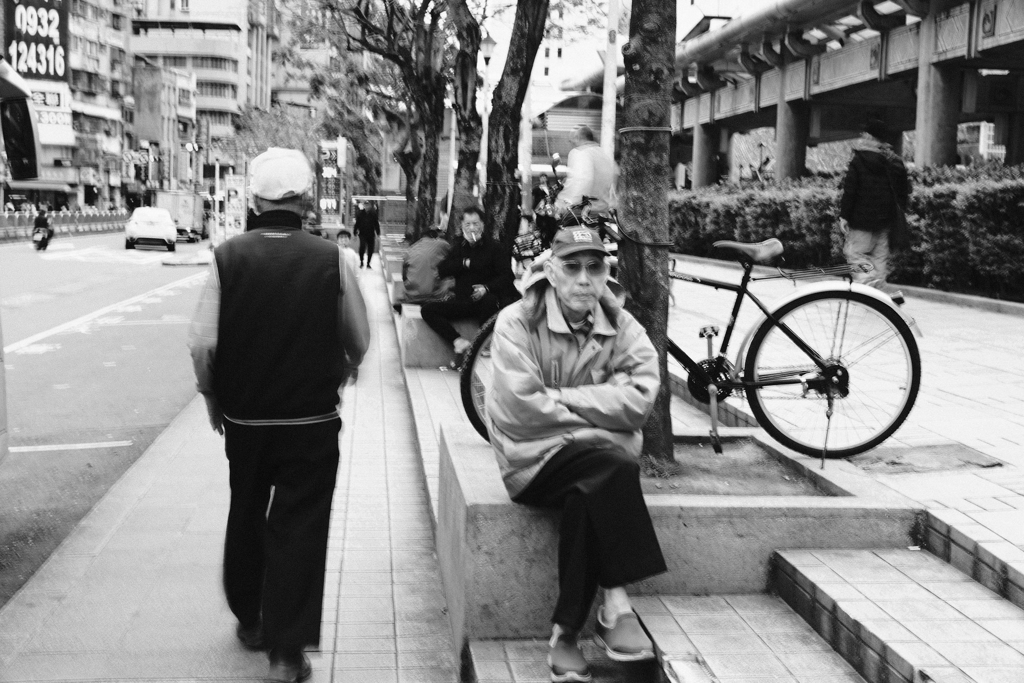 Traditional signage and street vendors in the heart of Wanhua, Taipei